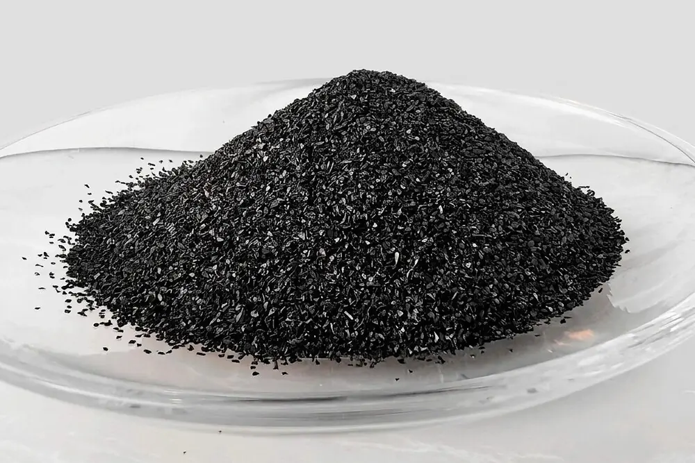 Fine granular activated carbon, mesh 8x30, heaped in a laboratory dish