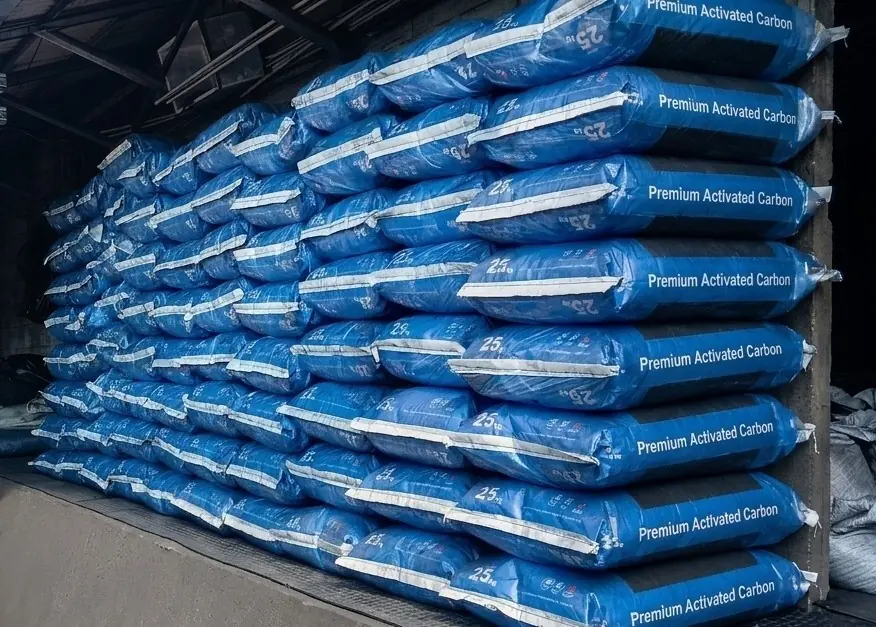 Sealed 25 kg sacks of activated carbon stacked for dispatch